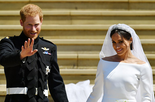 Hoàng tử Harry và vợ Meghan Markle trong hôn lễ ngày 19/5. Ảnh: AFP
